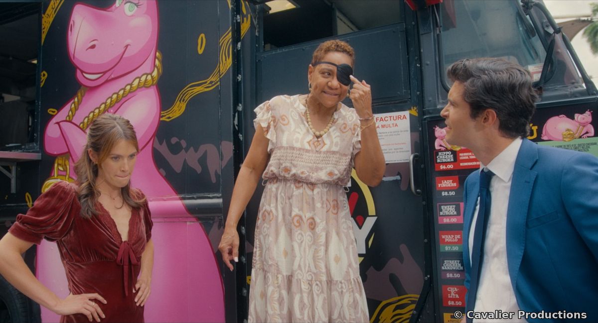 Liz and Dan at a food truck with a woman in an eye patch
